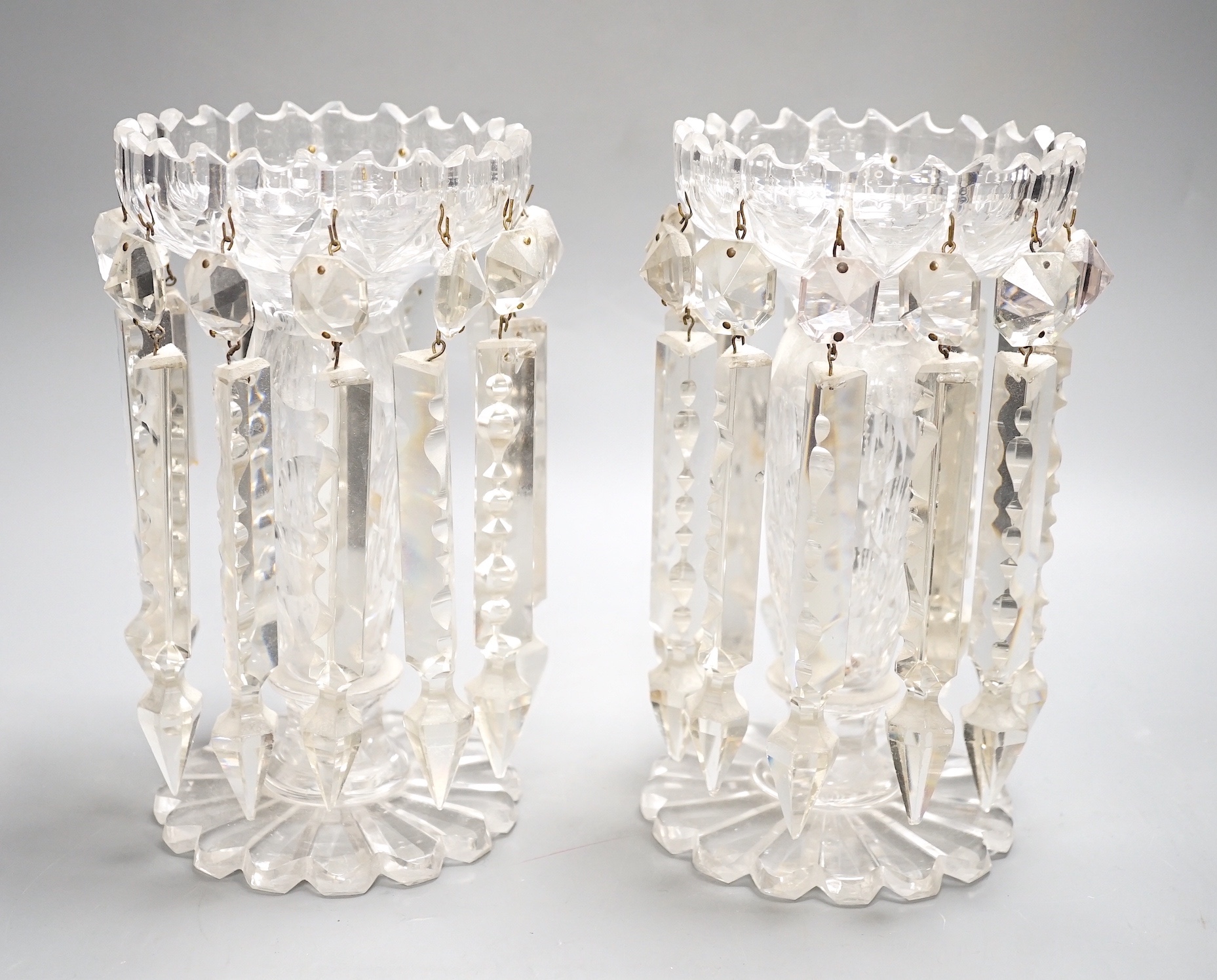A pair of Victorian cut glass candle holders with 'spear' lustre drops (faults), 23cm high